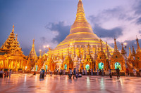 Thomas Schuster | Shwedagon. Documentary and fine art photography of Yangons Shwedagon Pagoda, capturing the golden architecture and the quiet devotion of those within the temple grounds.