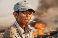 TOXIC WASTE FASHION (Waste Dump III). The inhabitants of the Stung Meanchey landfill, Phnom Penh, Cambodia. By Thomas Schuster